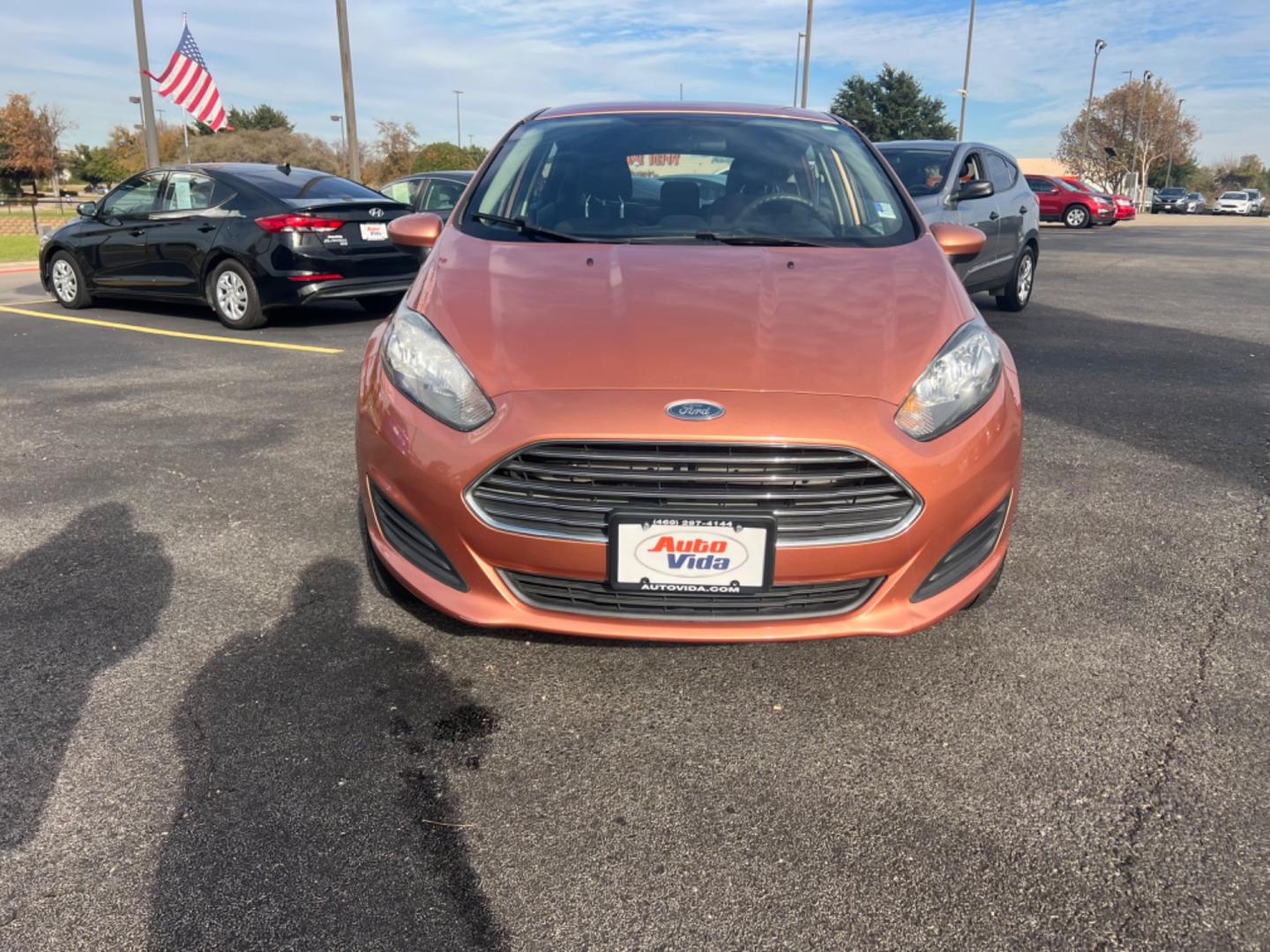 2017 ORANGE Ford Fiesta SE Hatchback (3FADP4EJ0HM) with an 1.6L L4 DOHC 16V engine, located at 420 I-35E, Lancaster, TX, 75146, (469) 297-4144, 32.593929, -96.823685 - Photo#7